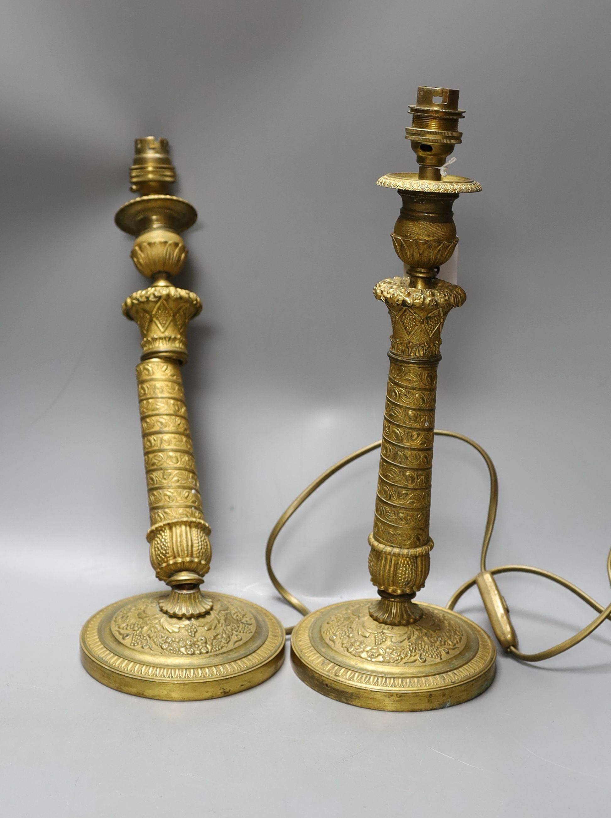 Pair of French Empire style ormolu candlesticks, converted to lamps, 36cm